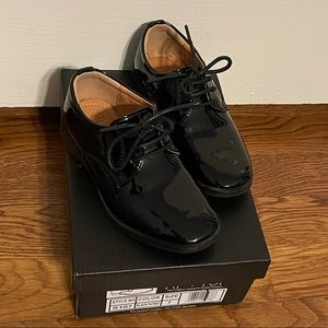 Little boys shiny black tuxedo shoes